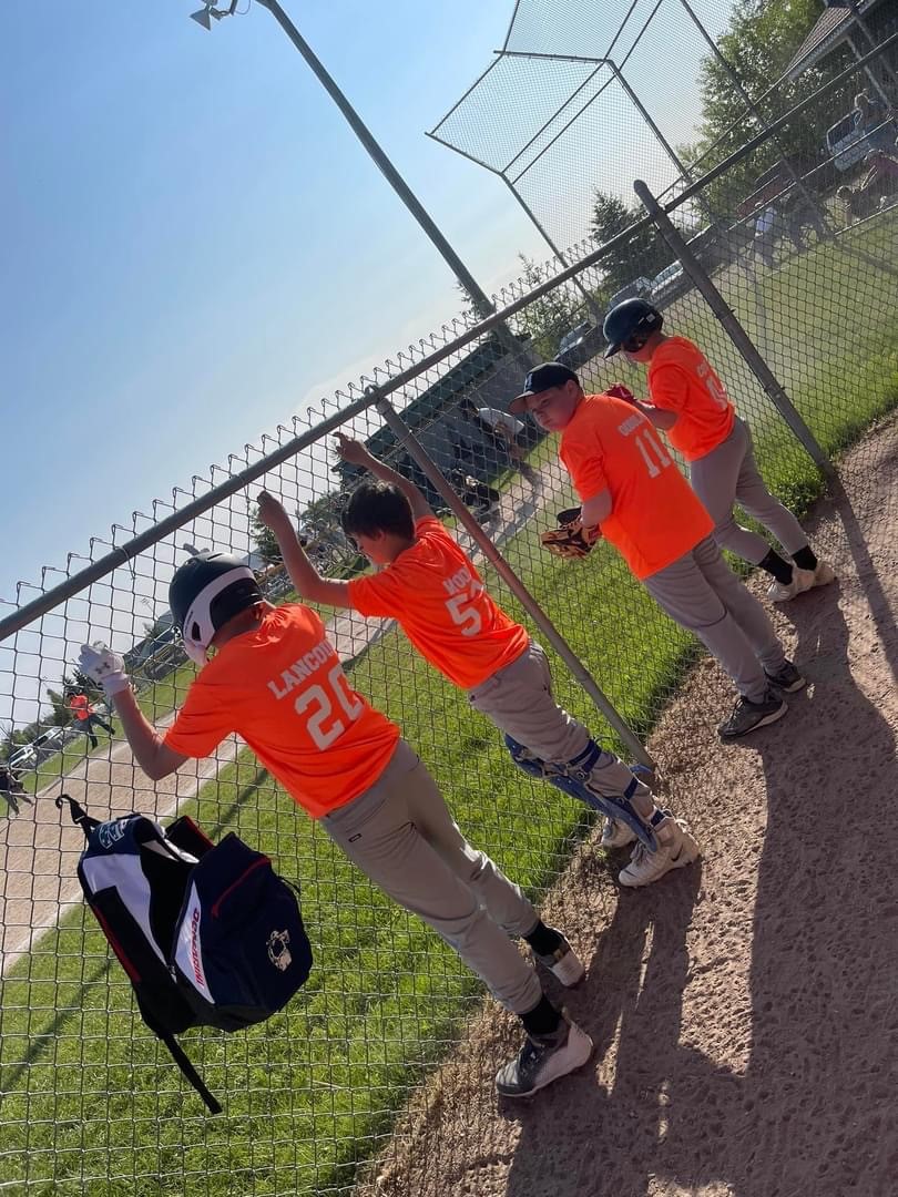 UP Baseball - One of the 4-H majors baseball teams cheers on their teammates.jpg